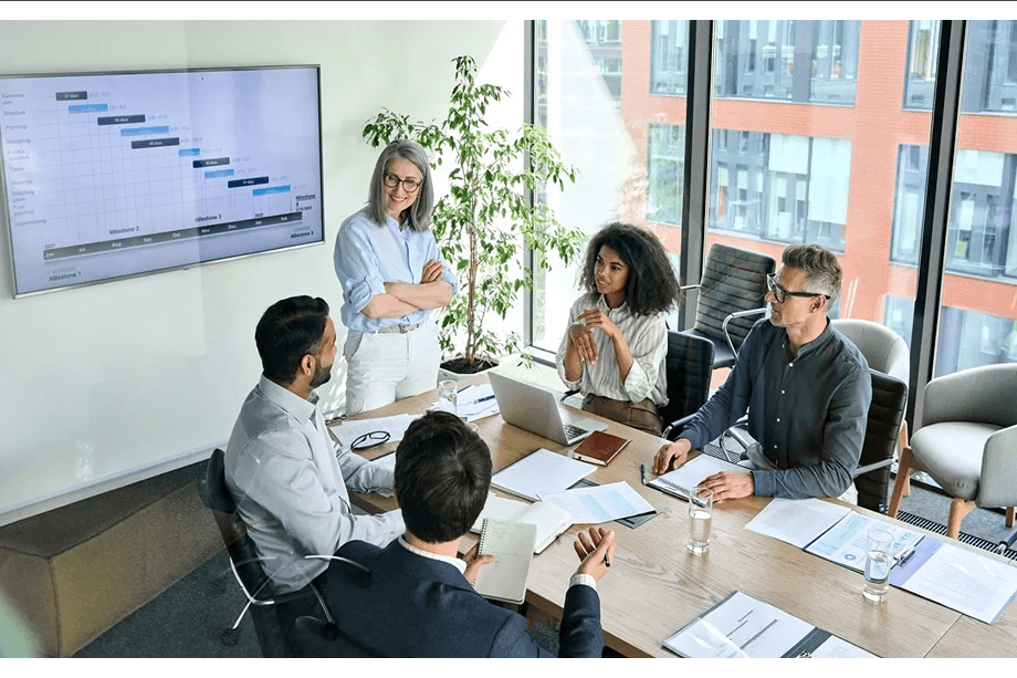 Team in boardroom discussing strategy